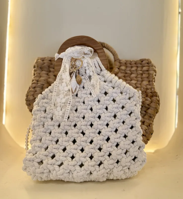 Finished cream macrame boho bag decorated with lace, pearls and charms