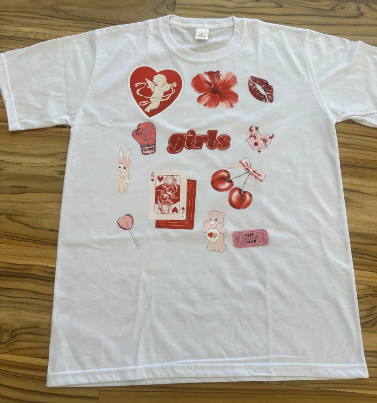 White t-shirt personalized with red and pink fabric stickers in Canggu